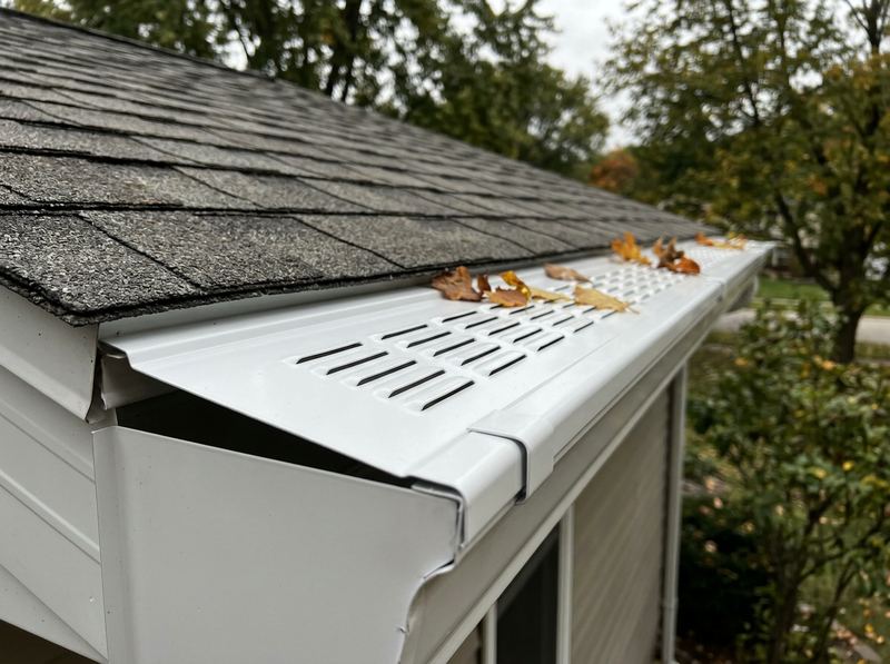A gutter with a louvered gutter guard